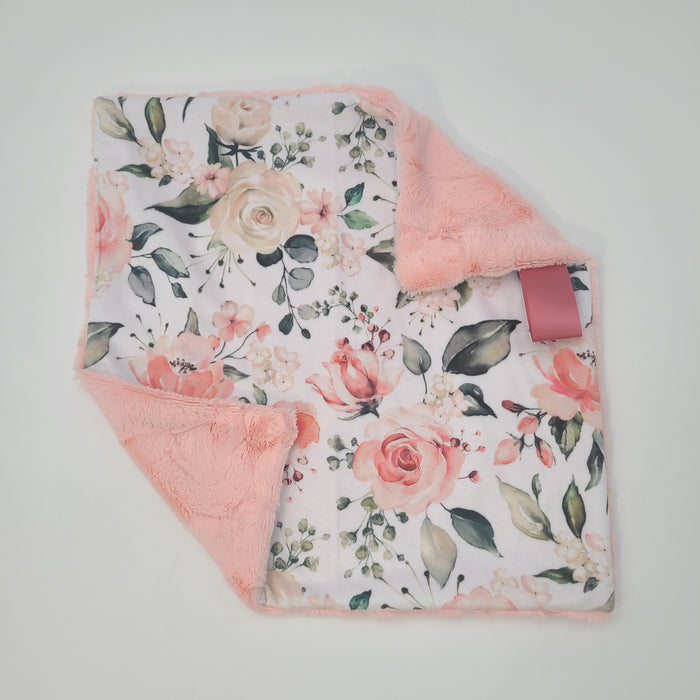 Peach floral lovey with shell hide backing