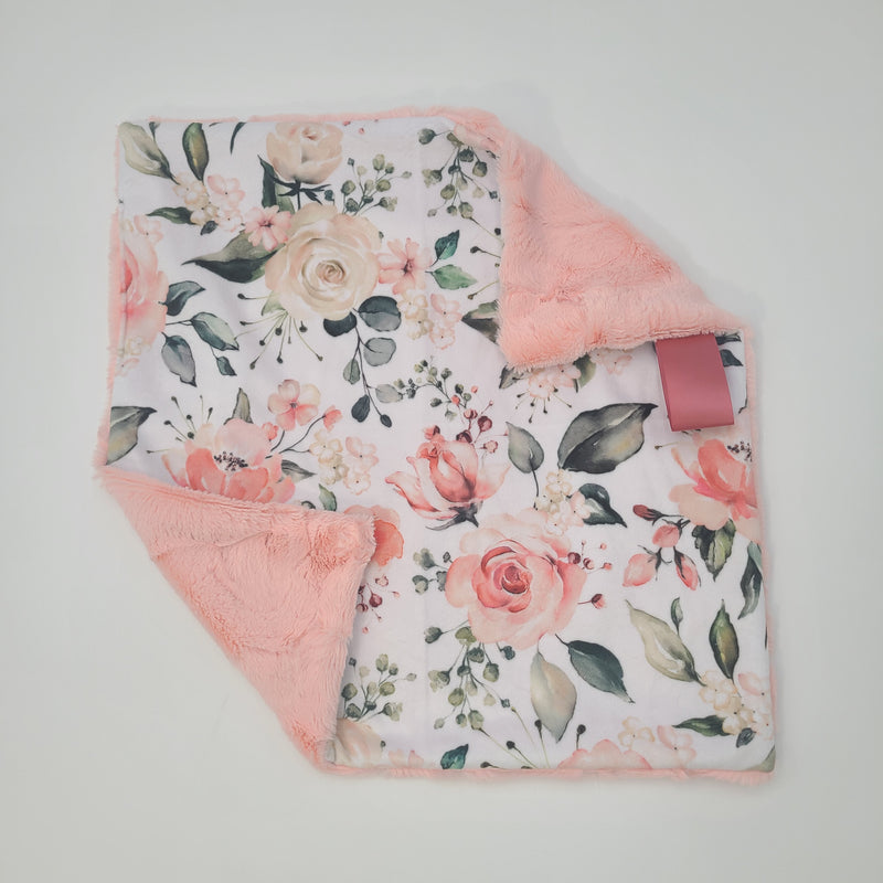 Peach floral lovey with shell hide backing